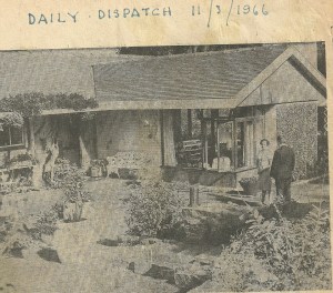 Daily Dispatch reporter interviewing my mother. The white, wrought iron bench in the centre of this photo is now in my garden.