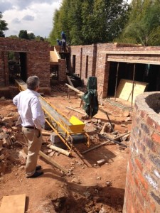 View from the driveway. Retaining wall around the cottage on the right.