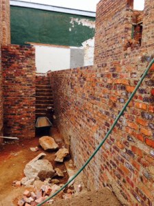 We have decided to put a door in the retaining wall on the right.