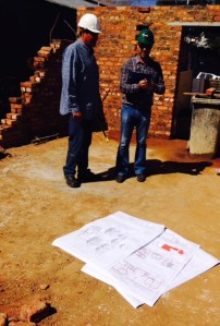 Bernard and Rupert discussing the changes to the guest-suite windows.