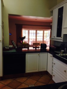 Hole knocked through to open kitchen up to the family room and garden.