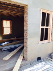 Windows being installed in the cottage.