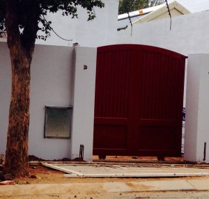 Electric Sliding Cottage Gate Installed.  To be painted white.