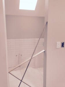 Tiling underway in the upstairs cottage bathroom.