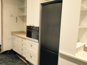 Fridge and Microwave in place.